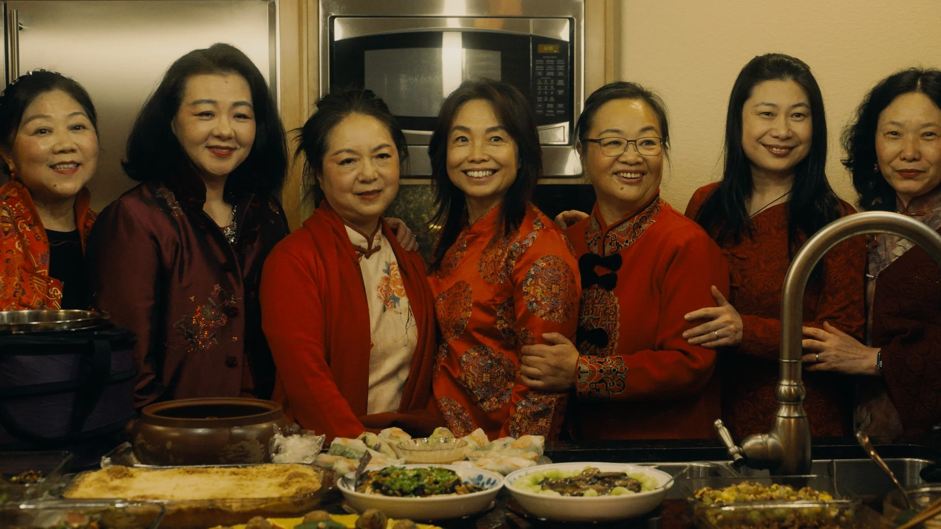 still shot from WHEN ARE YOU COMING HOME? a group of women pose for a picture on Lunar New Year
