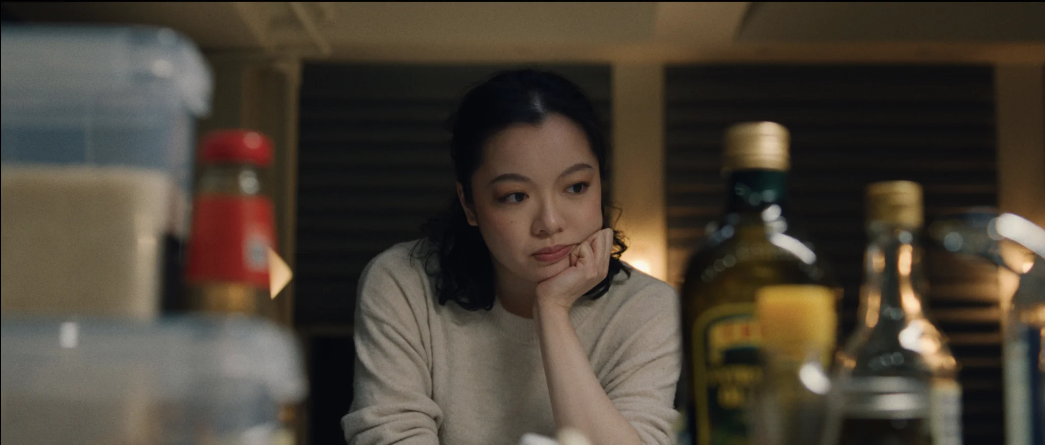 still shot from DID YOU EAT YET? a girl stares at her ingredients